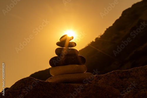 Photography Stones balance sunburst silhouette tranquil zen sunset stacking on mountain beac