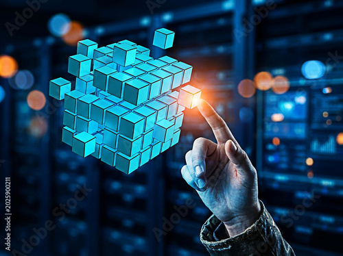 A person touches a glowing digital cube made of smaller blocks in this high tech photograph