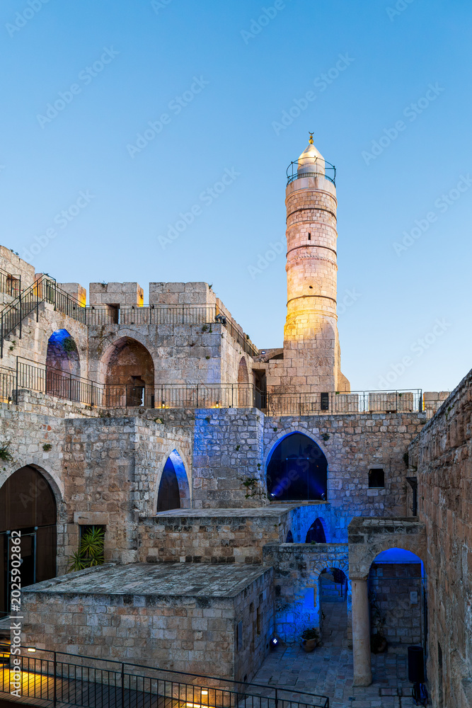 Fototapeta premium The Tower of David in the Old City of Jerusalem with evening illumination and lit by the rays of the setting sun.Israel.