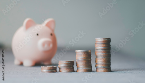 Quadro em tela Piggy bank, stacked coins representing financial savings, investment growth, wealth accumulation, budgeting, retirement planning, economic stability, passive income, money management
