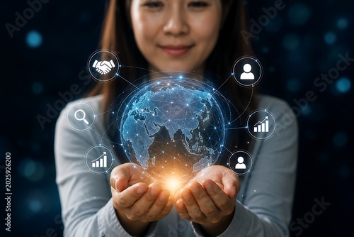 Woman holding a glowing holographic globe surrounded by icons representing global business and communication networks.