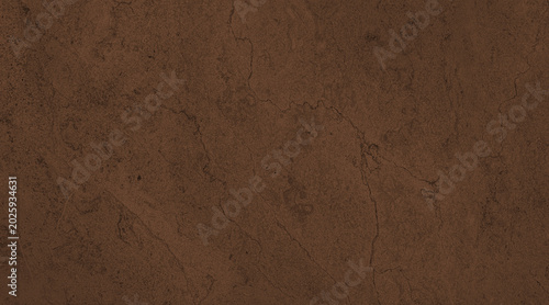 Foto A close-up of a dark, textured surface with subtle patterns, resembling raw eart