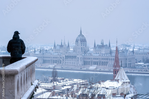 Bild auf Leinwand Winter view of the Hungarian Parliament Building from a snowy balcony in Budapes