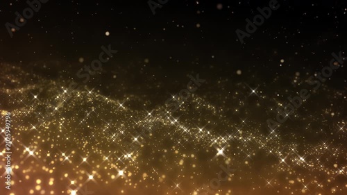Golden glitter particles dust powder shining stars abstract background
