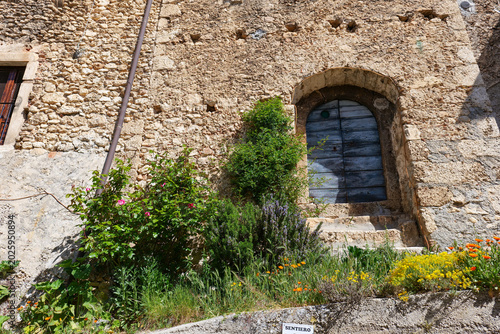 The facade of an old house in Calascio, a town in the mountains of Abruzzo.