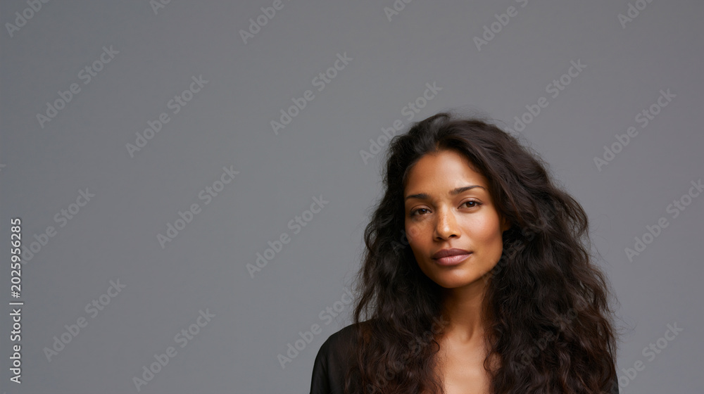 Obraz premium beautiful afro asian woman portrait with long hair and dark skin, elegant afro asian female studio headshot beauty portrait, confident multicultural woman beauty fashion studio closeup portrait