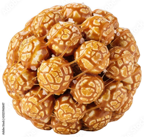 Golden salted caramel popcorn ball with glossy glaze and sea salt crystals isolated transparent background image
