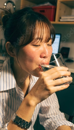 close up of woman drinking water
