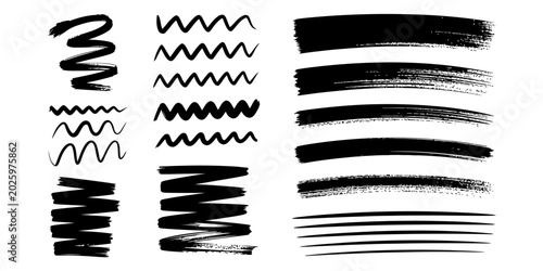 Foto Set of black ink brush strokes and wavy hand drawn lines for artistic design ele