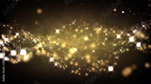 Golden glitter particles dust powder shining stars abstract background