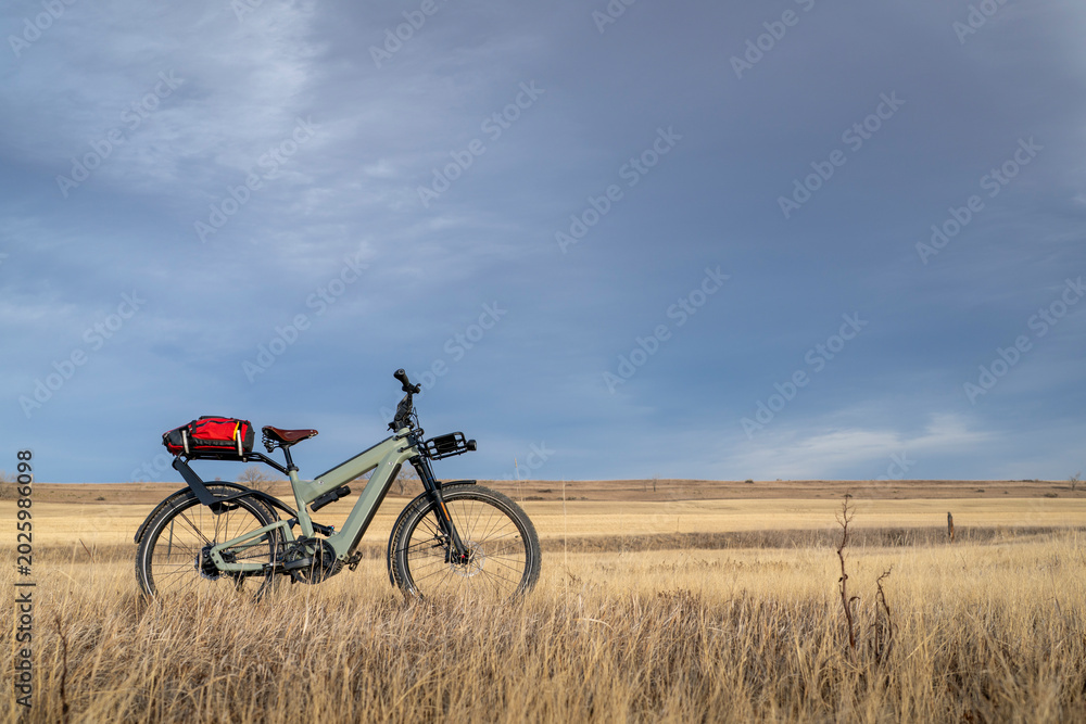Fototapeta premium touring e-bike on a prairie biking trail in Colorado foothills