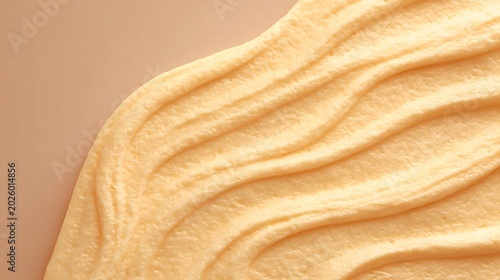 A warm macro view shows creamy ridges and fine surface texture. Useful for skincare, cosmetics, packaging, wellness, and sensory branding.