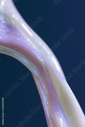 Slow motion aesthetic of a thin, iridescent liquid stream flowing gracefully against a dark blue background, showcasing smooth curves and reflective surfaces