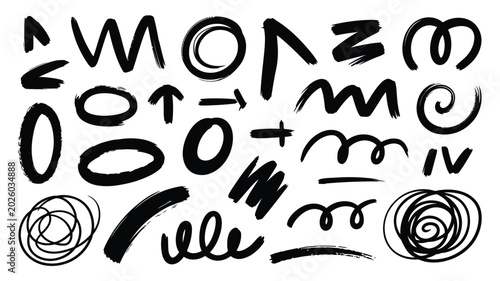 Foto Abstract black brushstroke symbols and doodles on a white background