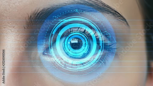 Close up of a human eye with a glowing blue digital HUD interface overlay for biometric security, tech concept