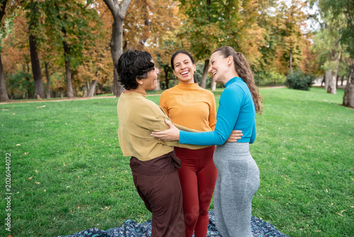 Women bonding in park during spiritual retreat and yoga