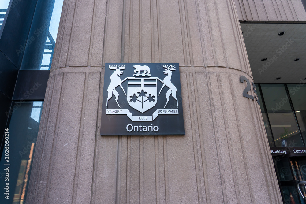 Fototapeta premium Toronto, Ontario, Canada - May 18, 2026: A coat of arms of Ontario on the building in Toronto, Ontario, Canada. The coat of arms of Ontario is the armorial emblem representing the Canadian province of