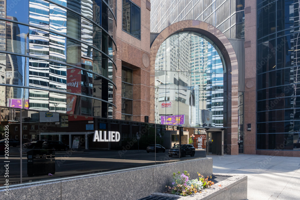 Naklejka premium Toronto, Canada - May 18, 2026: A signage for Allied at an office building in Toronto, Canada. Allied Properties REIT is a leading owner and developer of urban office space that enhances profi