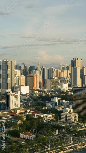 Aerial View of Manila Cityscape with Modern Skyscrapers. Vertical video