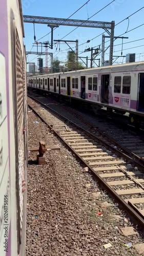 Mumbai Local Train Passing on Railway Tracks | Indian Railways Mumbai Suburban Train Stock Footage with Urban City Railway Scene in Maharashtra India