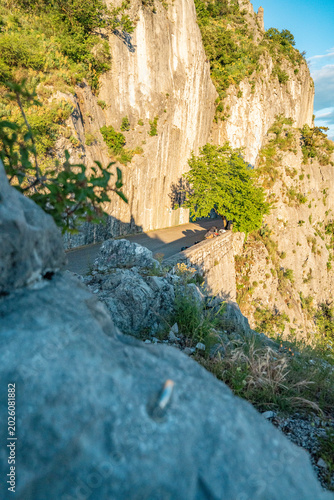 Limestone Cliff Face With Steel Abseil Bolt - Napoleonica Climbing Bouldering Area Trieste Karst, Adriatic Sea View Background, Italy Outdoor Sport Rock Climbing