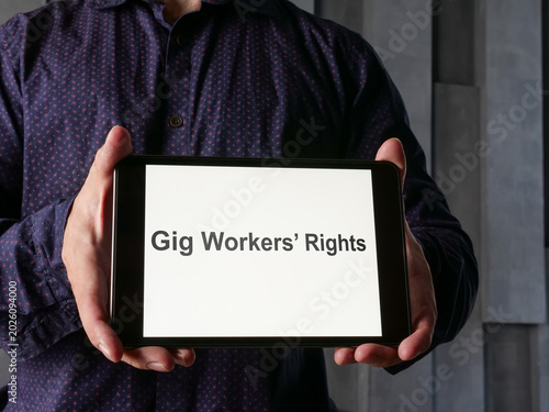 Gig workers rights concept on tablet. Freelance labor protection.