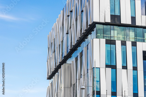 Close-up view of Uppsala Concert and Congress building facade with modern glass windows. Sweden.