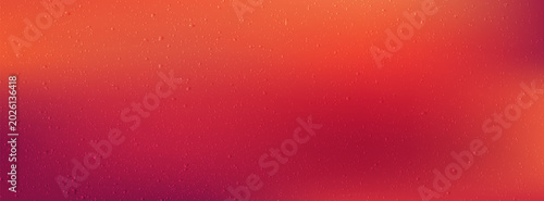 Abstract orange and magenta gradient background with textured droplets