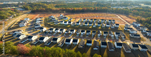 Aerial view of real estate development with tightly located family houses under construction in Carolinas suburban area. Concept of growing american suburbs