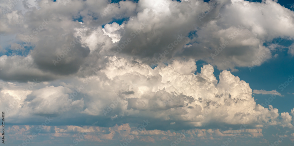 Fototapeta premium Blue sky with white clouds. Bright summer skyscape