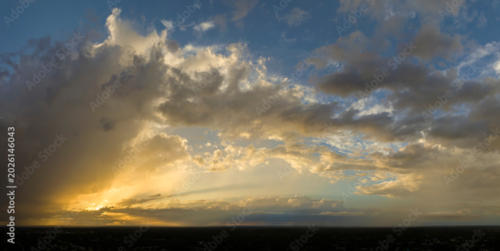 Obraz premium Evening sunset sky with colorful clouds. Panoramic skyscape