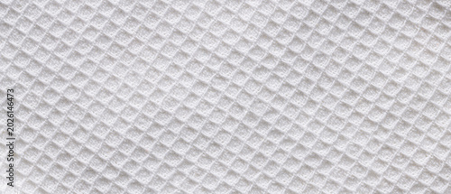 White waffle cotton fabric texture background with diamond pattern for clean soft textile backdrop