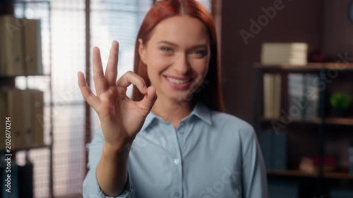 Portrait happy Caucasian businesswoman showing ok sign business woman show okay symbal allright gesture smiling looking at camera student girl female demonstrate positive agreement success in office