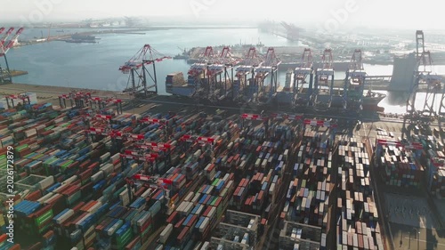 Drone view of stacked containers and rail corridors at Long Beach port