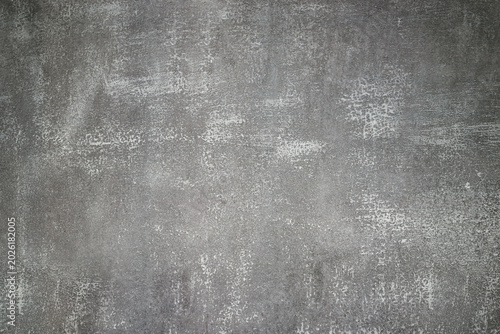 Fotografija grey texture of old cement with a porous granular surface