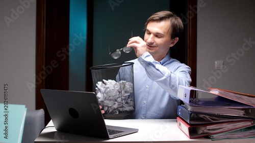 Bild auf Leinwand Businessman discarding balled up paper, representing feelings of frustration, fa