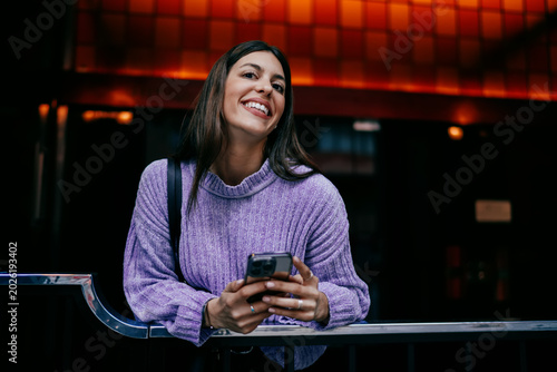 Young woman looking up with smile while working on tablet with electronic pen. Ambition, career goals, and digital transformation. Female expert using modern software for business task, remote life.