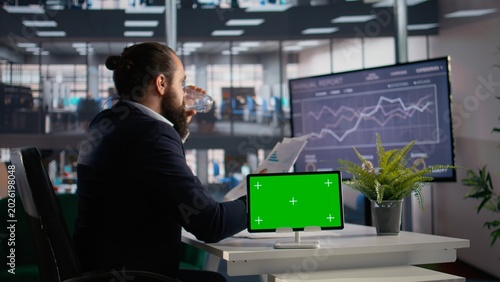 Konstfotografi Isolated screen on tablet with CEO reviewing company data and insights, planning development strategy after evaluating performance and profitability metrics