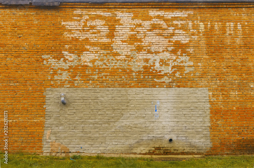 Bild auf Leinwand Worn brick with peeling paint