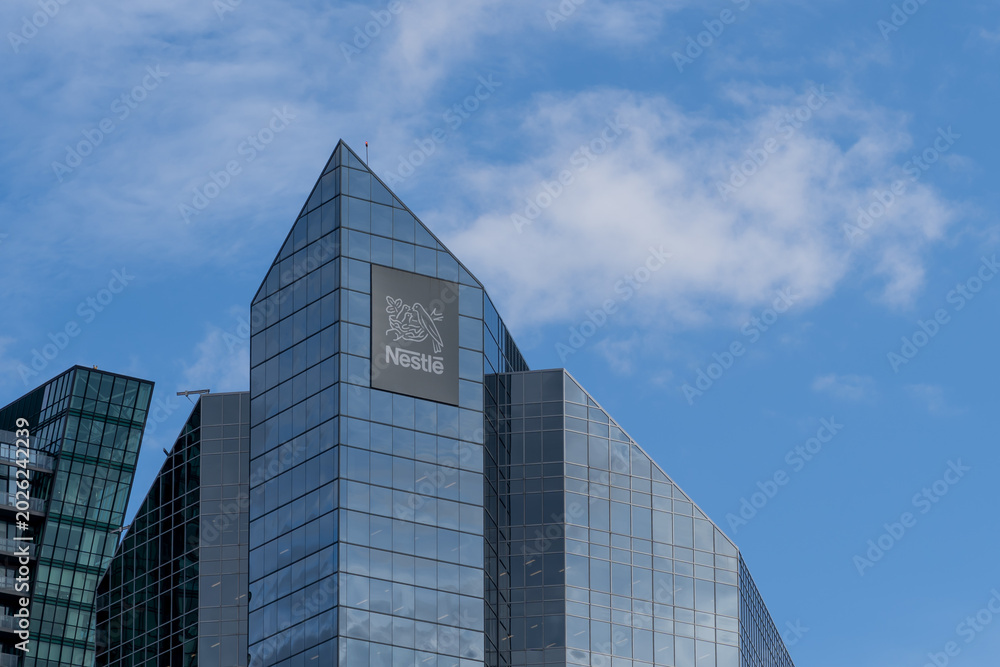 Naklejka premium Toronto, Ontario, Canada - May 6, 2026: Nestle’s Canadian headquarters on Sheppard Avenue West in North York, Toronto, Canada. Nestle SA is a Swiss multinational food and drink processing conglomerat