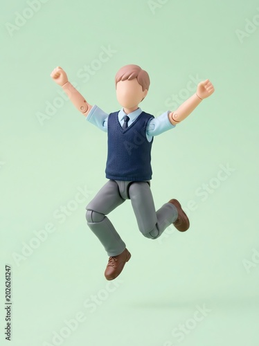 Joyful Male Action Figure Jumping with Arms Raised, Expressing Excitement