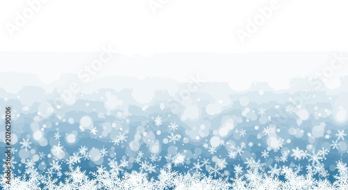 Winter background with white falling snowflakes and bokeh lights on blue gradient