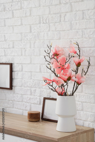 Vase with artificial flower...