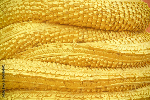 Colorful gold yellow naga scale patterns on background