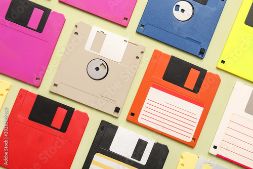 Composition with different floppy disks on green background