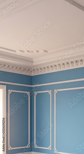 Elegant blue room with ornate white crown molding and ceiling