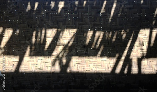 Partition wall made of woven bark with cylindrical bamboo as the main structure