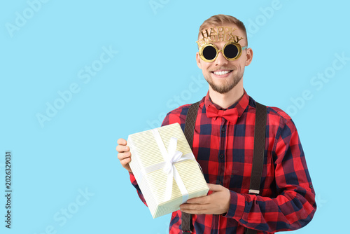 Young man with party glasse...