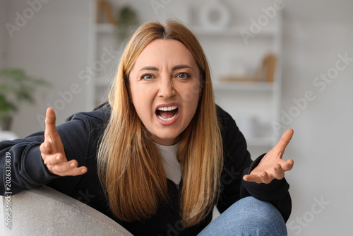 Angry mature woman shouting...