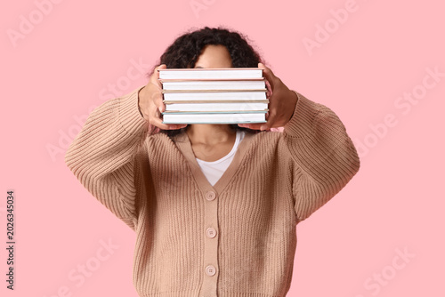 Young woman hiding face wit...